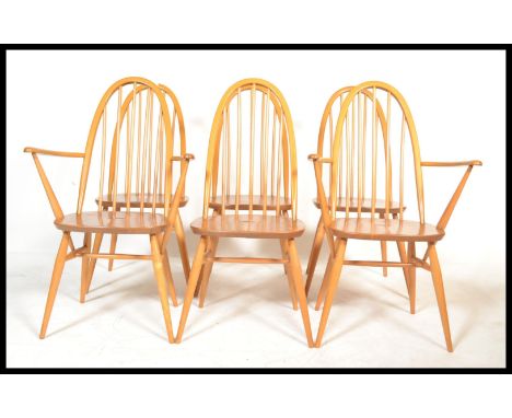 A set of six Ercol Windsor Quaker hoop-back dining chairs in light elm consisting of four dining chairs with two matching car