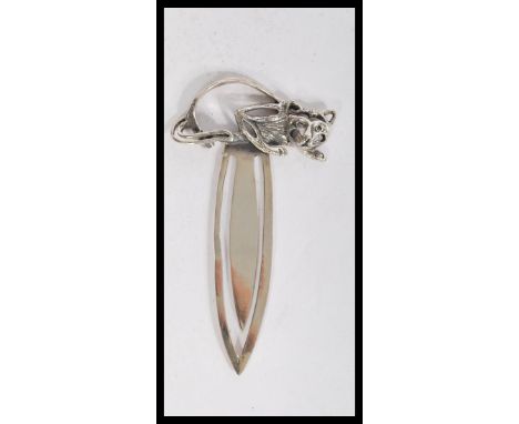 A sterling silver large paperclip book mark having a cat finial.