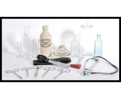 A collection of pre war and post war vintage&nbsp; glass apothecary / pharmacy and medical items to include forceps,glass mea
