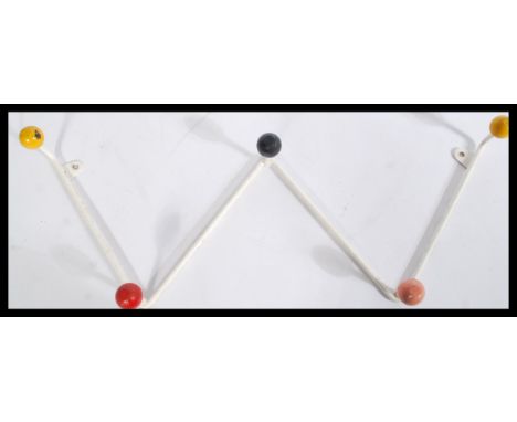 A set of vintage 20th century retro sputnik atomic coat hooks of zig-zag form having a white enamel finish with coloured ball