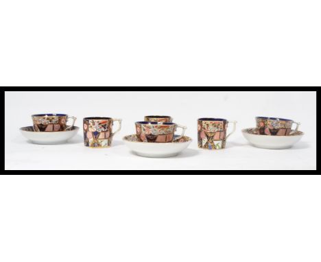 An early 19th century Derby&nbsp;c1806-1825 group of three Imari pattern cups and saucers along with three matching coffee ca