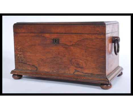 A Victorian rosewood sarcophagus shaped tea caddy, with a quarter reel moulded border, hanging ring carrying handles ( one mi