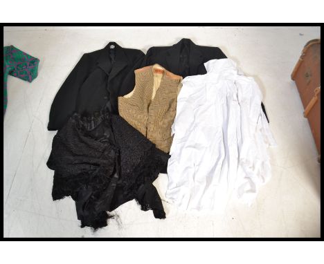 A good collection of vintage clothing dating to the early 20th Century to include a ladies lace work shawl, gents tails ( pro