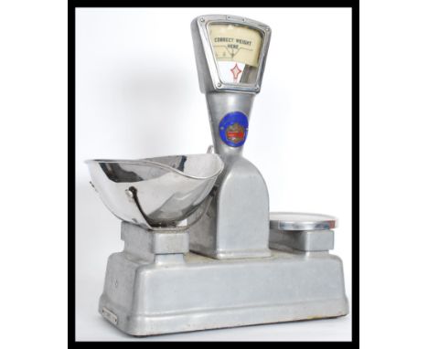 A set of vintage 20th century Industrial Vandom and Hart enamel weighing scales along with a set of vintage weights.