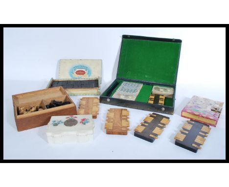 A collection of vintage 20th Century parlour game items to include several wooden whist scorers, cards, dominoes, chess piece