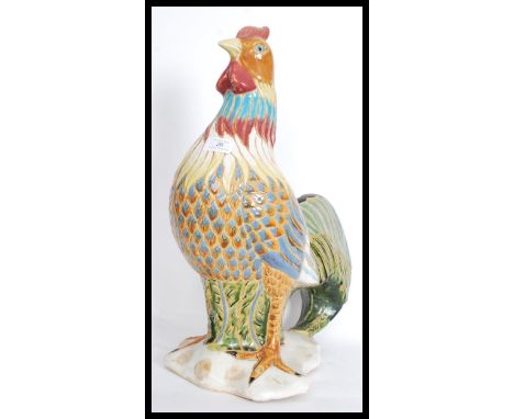 A large 20th century ceramic model of a cockerel rooster hand painted in vibrant colours. No visible makers mark but believed