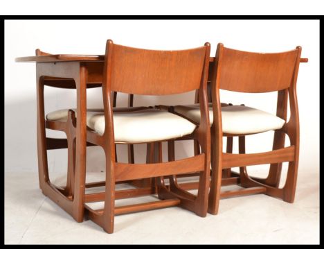 A vintage retro 20th Portwood Furniture teak Danish Influence table and set of four dining chairs. Raised on shaped angular s