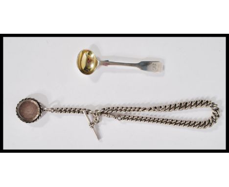 A heavy silver hallmarked Albert chain having a T bar clasp and coin pendant. Along with a Victorian chocolate ladle. Weighs 