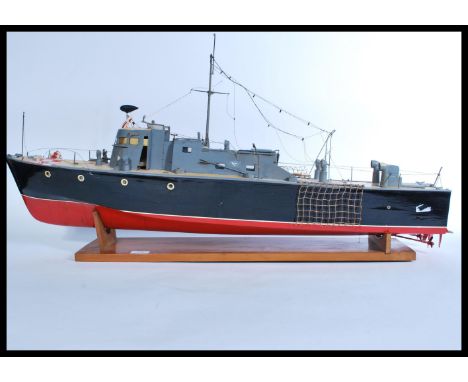 A vintage early 20th century scratch built scale model of an Air Sea and rescue life boat on wooden plinth stand.