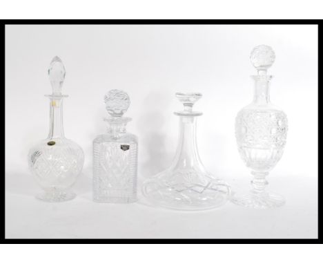 A group of vintage cut crystal glass decanters to include Thos Webb , Wordsley , ships decanter and another tall example with