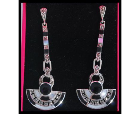 A pair of sterling silver Art Deco style drop earrings having opal and onyx panels with marcasite decoration.