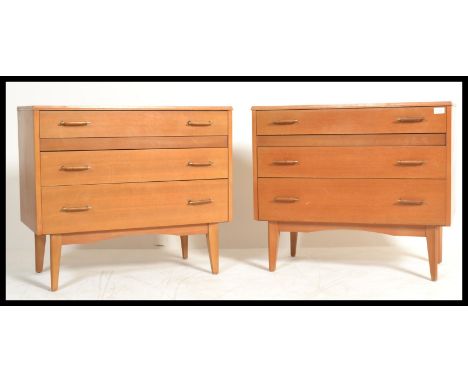 A paid of retro, vintage teak chest of drawers, each with 3 drawers.&nbsp;Measures: 69cm high x 79cm wide x 39cm deep.