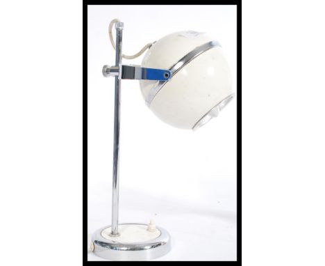 A vintage retro 20th century Eye Ball desk spot light lamp having cream base with chrome mounts. Measures 32 cm high and 19 c