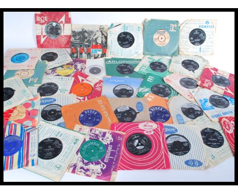 A group of vintage 1960's 45rpm vinyl record singles including The Beatles , The Rolling Stones , Rod Stewart etc. Please see