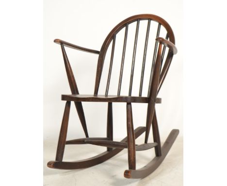 A mid 20th century Ercol rocking chair in beech and elm raised on turned legs with sleigh runners. Measures&nbsp; 86cm x 62cm