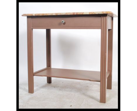 A 20th century French oak and marble console table. The vanilla and rouge veined marble top over painted base being raised on