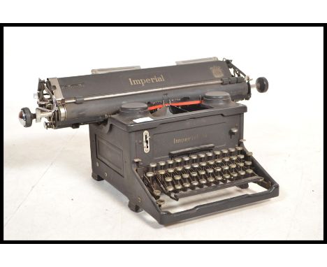 An early 20th century vintage industrial manual typewriter by Imperial, having an A3 roller. Measures: 30cm high x 62cm wide 