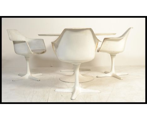 A vintage retro 20th century Arkana tulip table along with four Marcel Burke matching tulip armchairs. The table and three of