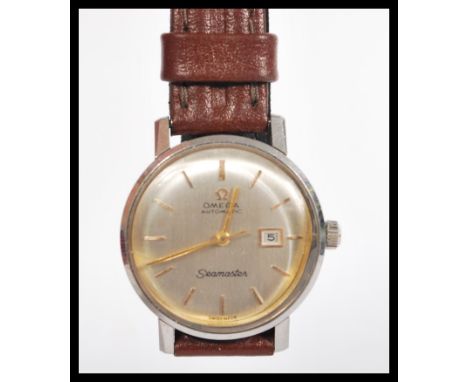 A vintage 20th century Omega Seamaster automatic wrist watch having a silvered dial with gilt baton numerals faceted hands an