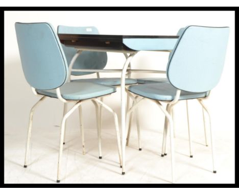 A vintage retro 20th century 1960's set of blue formica kitchenette table and four chairs raised on tubular supports with pad