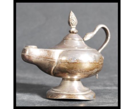 An early 20th century Edwardian hallmarked silver table lighter in the form of an oil lamp / Aladdin 's genie lamp&nbsp; with