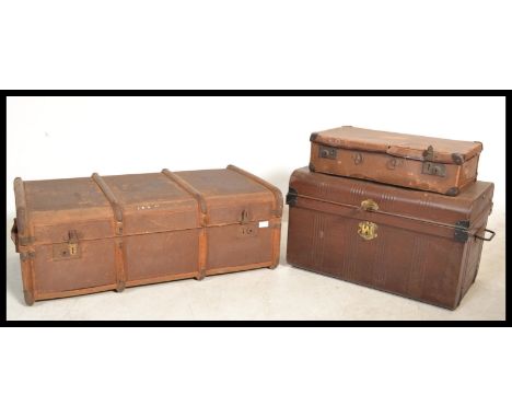 A group of vintage 20th century retro luggage to include a canvas and wooden bound steamer trunk , a tin trunk box and a leat