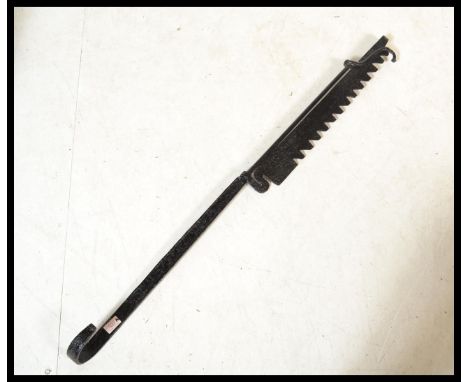 A 19th Century Victoria&nbsp; cast metal Fire side roasting tool, adjustable&nbsp; ratchet / pot jack&nbsp; top section, with