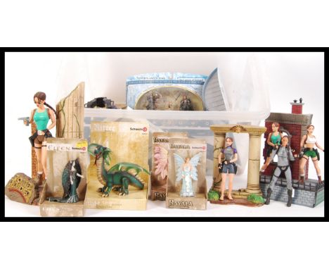An assorted collection of boxed and loose action figures comprising of boxed Schleich figures , several loose Lara Croft and 