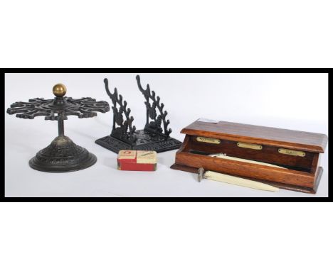 A group of vintage desk / postal office items to include cast metal ebonised pen rest and matching stamp holder along with wr