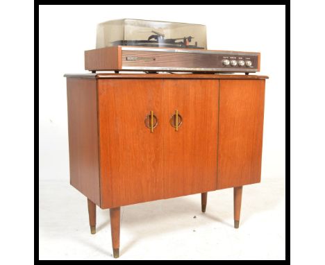 A vintage retro Prinz Sound stereo system 6 having a Garrard 2025 record deck above a teak music cabinet with doors to front 