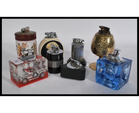 A collection of vintage table lighters to include Cailbra , acrylic blocks , Cameo , Polo , Ronson , Chalice etc. Highest mea