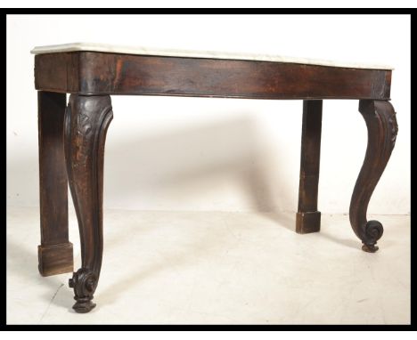 A 19th century Victorian large marble console hall table raised on scrolled oak cabriole legs with acanthus leaf shoulders. T