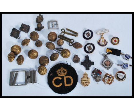 A collection of Military buttons, cap badges, Civil Defence cloth badge, enamel badges to include Trade Union,silver hallmark