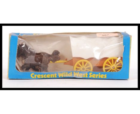 An original vintage Crecent Toys made ' Wild West Series ' No. 142 Wagon '. Appears mint and unused, within the original box 