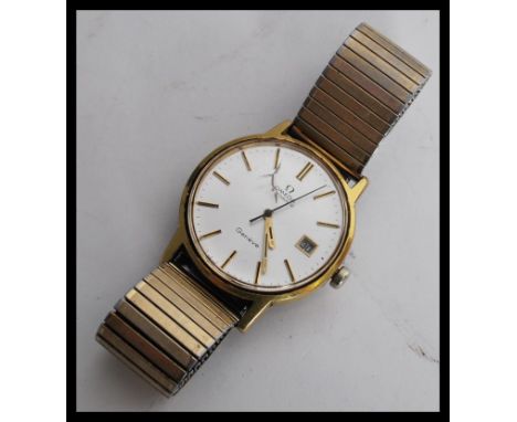 A vintage 20th century Omega Geneve 1970's gents wrist watch having a silvered dial with gilt baton numerals and faceted hand