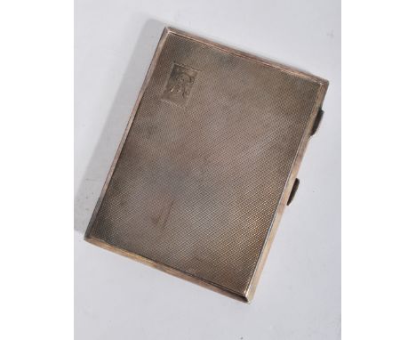 A silver hallmarked cigarette case with monogram cartouche and engine turned decoration. The marks for Birmingham 1946 by J G