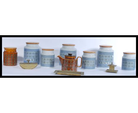 A collection of Hornsea ceramic kitchen storage jars in the Tapestry pattern having wooden lids. Various sizes and some with 