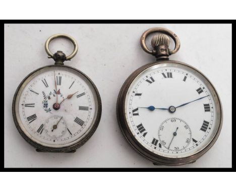 Two silver pocket watches to include a small ladies example with white enamel face Roman numeral chapter ring and gilt facete