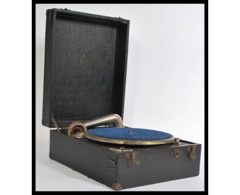 A vintage early 20th Century circa 1920's black vinyl cased picnic gramophone, side wind handle with carry strap to side.