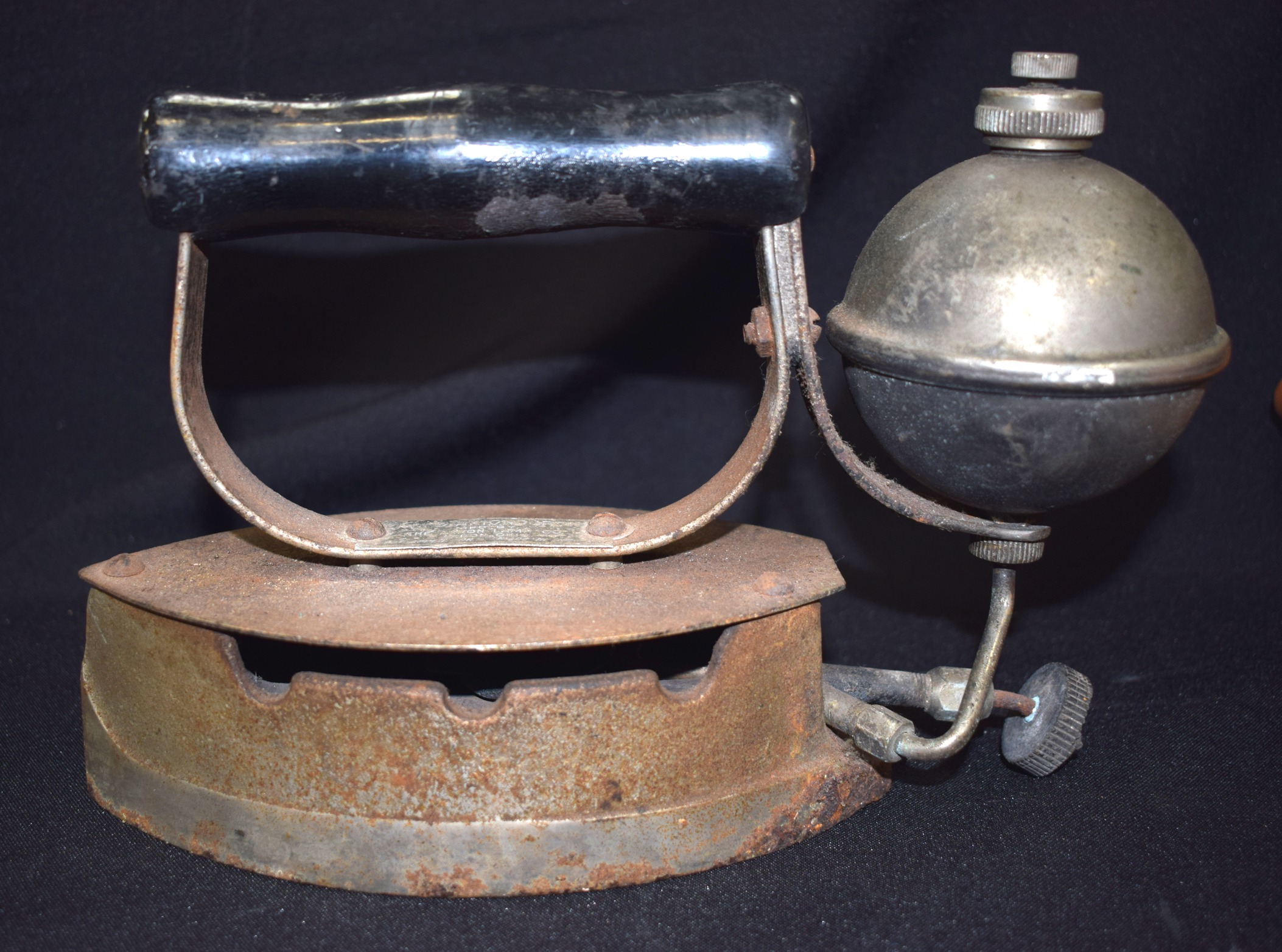 AN EARLY STEAM IRON, 23 cm wide.