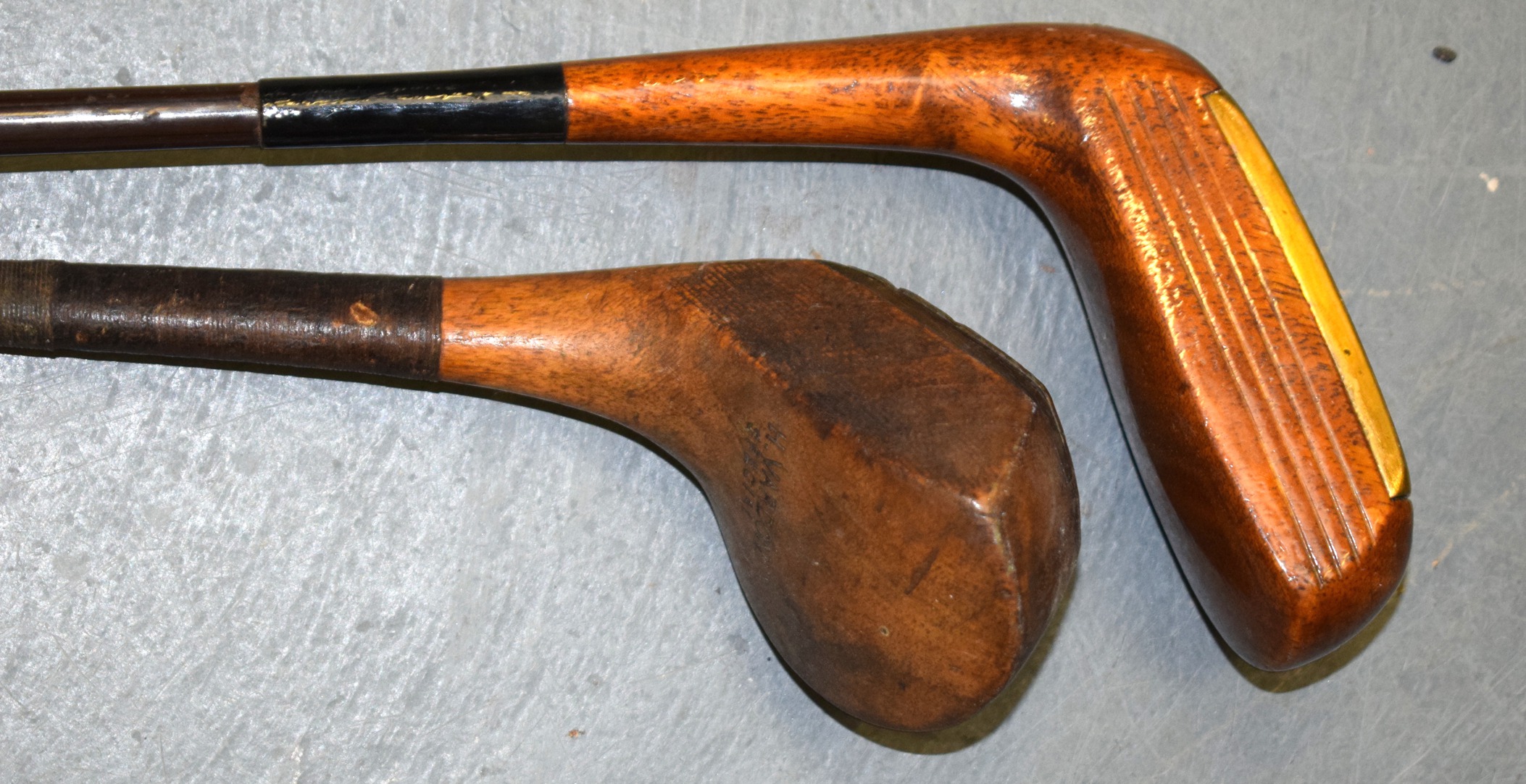 TWO VINTAGE WOODEN GOLF CLUBS.