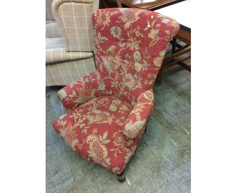 A rouge floral pattern button back chair
