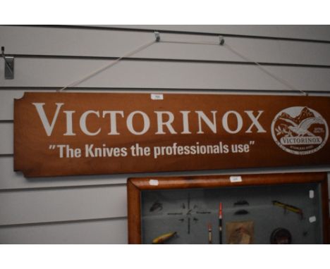 A shop display sign of ' VICTORINOX' makers of swiss army knives