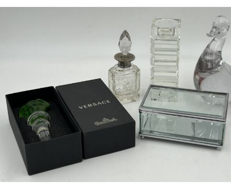 A Versace Rosenthal glass bottle stopper, a London 1922 Willian Henry Sparrow perfume bottle together with a candle holder an