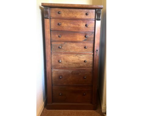 A 19thC mahogany Wellington chest of 5 drawers and secretaire with drop front. 124cm h x 60cm w x 41cm d.