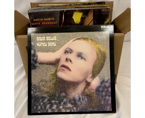 A collection of 36 Vinyl Album to include David Bowie (5) Elvis Presley, Rolling Stones, John Lennon, Asia, Black Widow, Alic