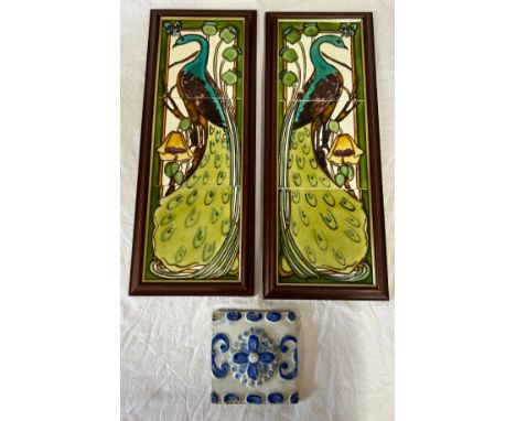 Two sets, of three framed tiles depicting peacocks together with a single blue and white tile. Frame 50 x 20.5cm.