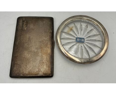 Silver cigarette case Birmingham, date mark rubbed, 14cm x 8cm, weight 200gm, together with a silver topped glass wine coaste