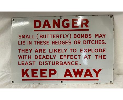 WWII related enamel sign 'Danger - small butterfly bombs' 40cm x 30.5cm with 6 drilled holes for fixing on wall.