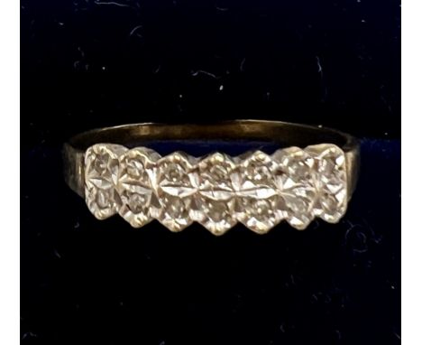 A nine carat gold diamond set ring. Size Q/R. Weight 2gm.